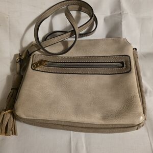 Elegant Beige Crossbody Bag with Tassel